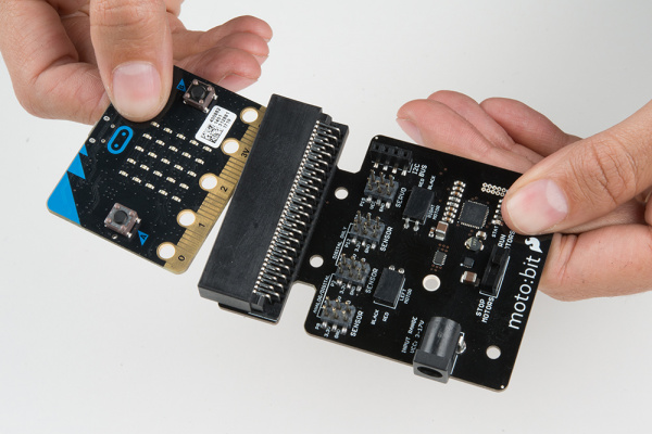 Inserting micro:bit into moto:bit
