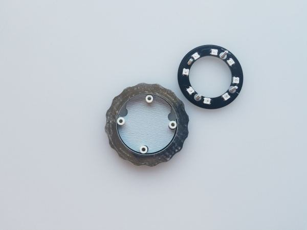 The larger ring shaped board is now sitting on top of the round board with four nylon standoffs sitting along its inside circumference. The LED ring still sits to the side.