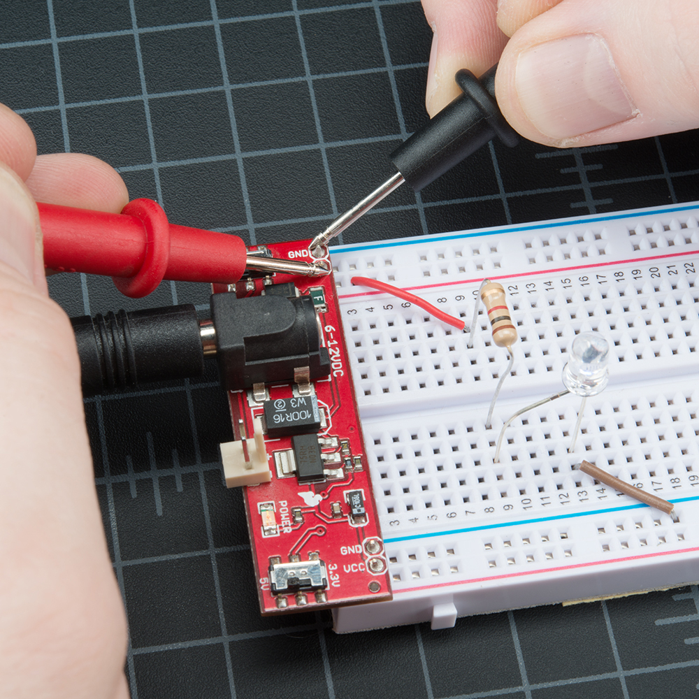 How do you test a battery with a multimeter?