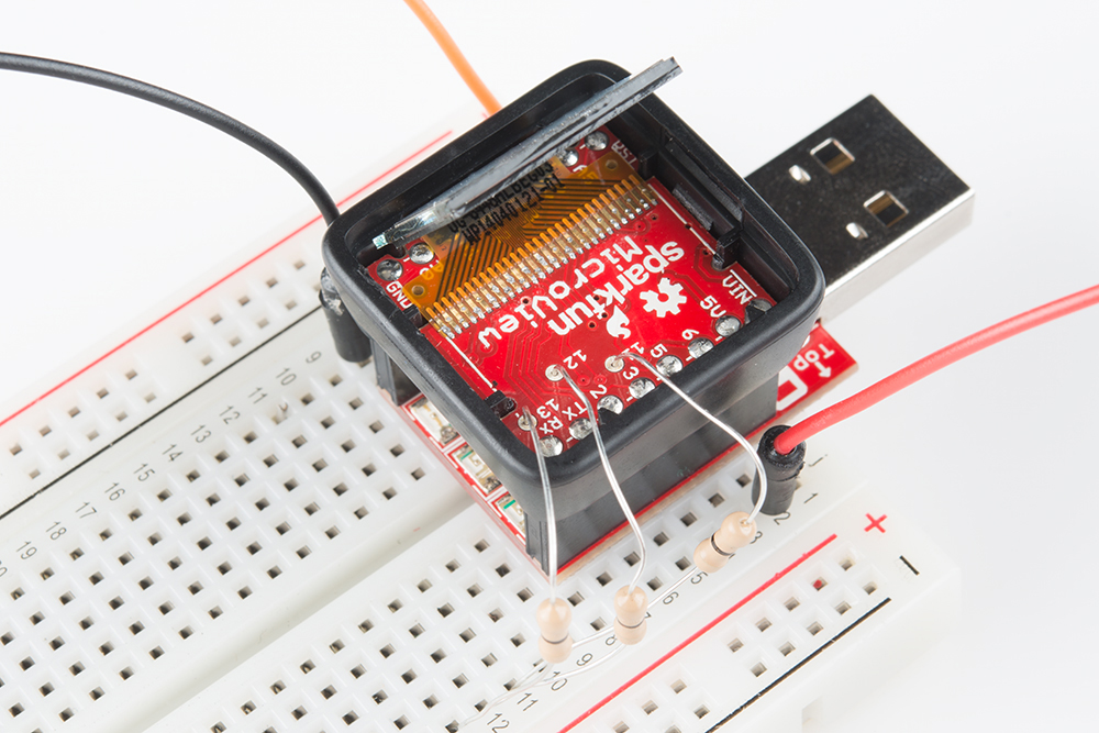 AVR microcontroller being reprogrammed with the help of 0Ω resistors