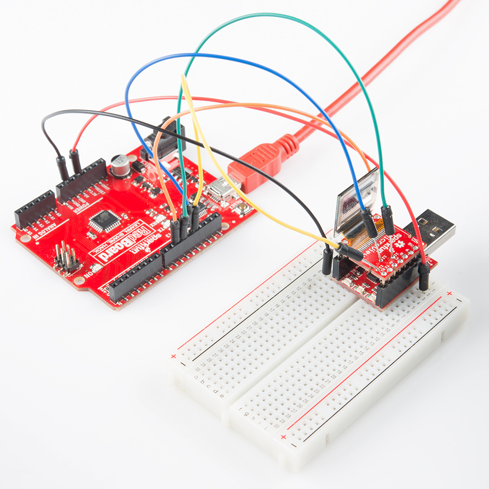 AVR microcontroller being reprogrammed with the help of jumper wires