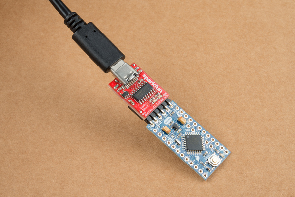 This image shows the product with a USB-C cable plugged in and on the opposite end a Arduino pro Mini plugged into the female header.