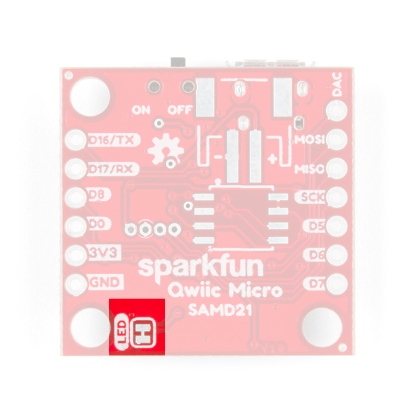 This image shows the bottom of the SparkFun Qwiic Micro with the USB facing up and highlights a small jumper located in the lower left of the board near the screw hole. 