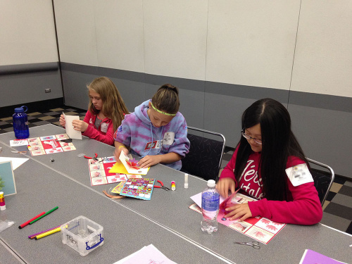 Girls working on the lotus cards