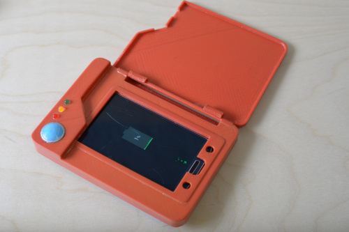 photo of the completed Pokédex charging a phone