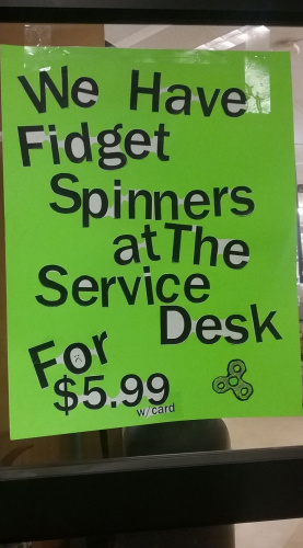Picture of a sign advertising fidget spinners at my local grocery store