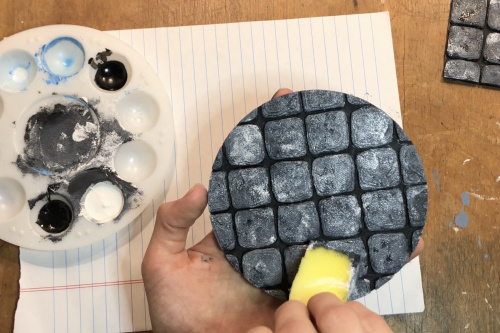 Painting the dungeon floor with a sponge to achieve a stony texture