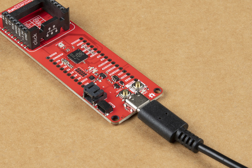 RP2040 mikroBUS™ development board connected with a USB cable