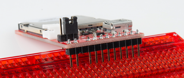 Headers soldered on to breakout, inserting into breadboard