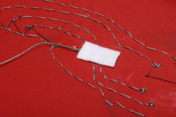 Insulating the conductive thread traces 1