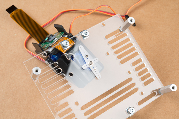 Pan-tilt mechanism mounted to mounting plate