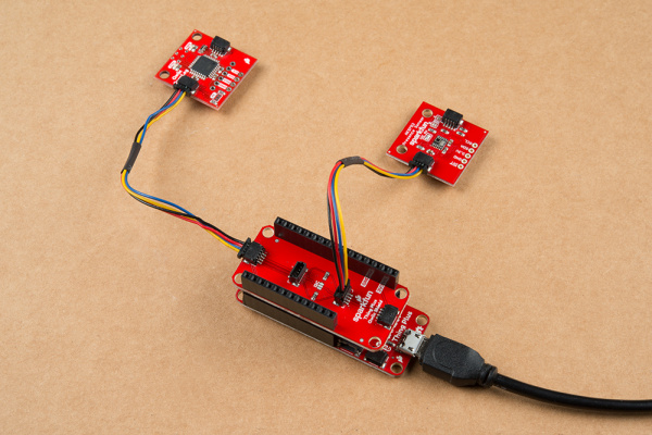 Qwiic Shield connected to a Thing Plus board with two Qwiic devices.