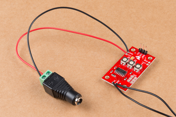 Photo showing wire soldered to the VCC and GND pins on Servo Trigger and connected to DC Barrel Jack Adapter