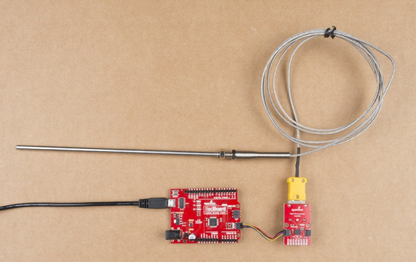 Picture of board, plugged into a redboard, plugged into a K-type thermocouple