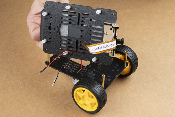 Showing where to route motor leads through the top plate