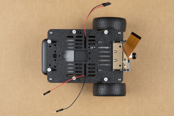 Top view showing four screws securing top and bottom plates