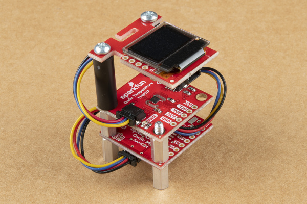 Qwiic Cable Connecting the Qwiic micro, Qwiic TMP117, and Qwiic micro OLED