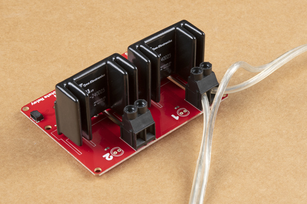 Photo showing one AC load attached to relay screw terminals