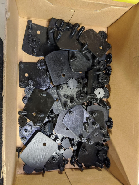 3d printed parts in a bin