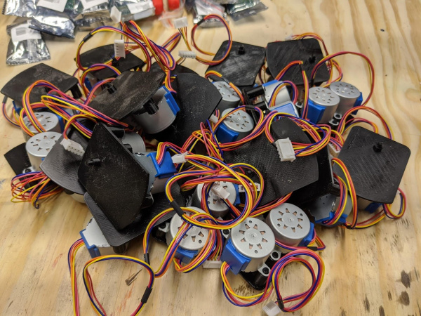 Assembled clock motors in a bin