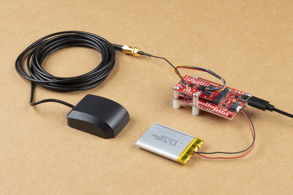 A completed GPS logging circuit with USB, Battery and GPS antenna attached.