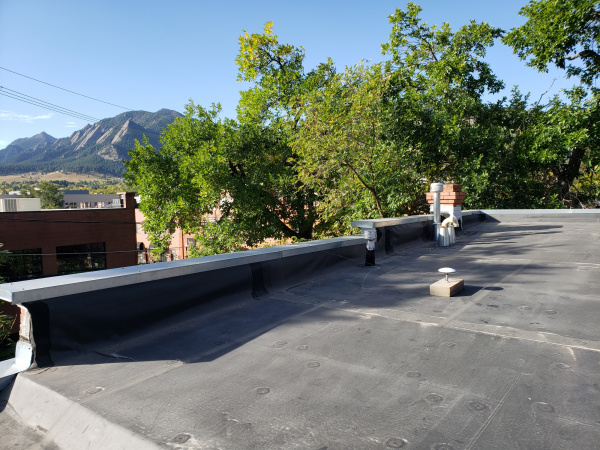 Antenna on roof attached to cinderblock