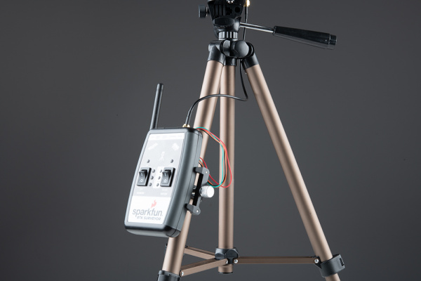 Cell phone clamp on the side of a tripod with RTK Surveyor