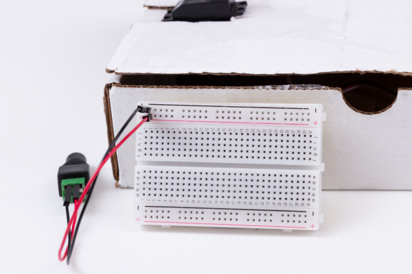 Attach the power jumper wires to the breadboard