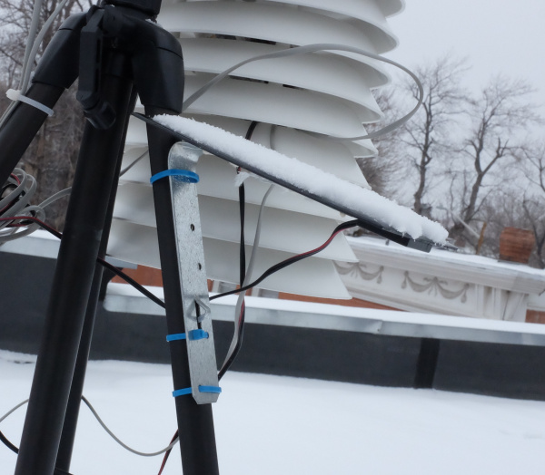 Solar panel with bent metal holding it on