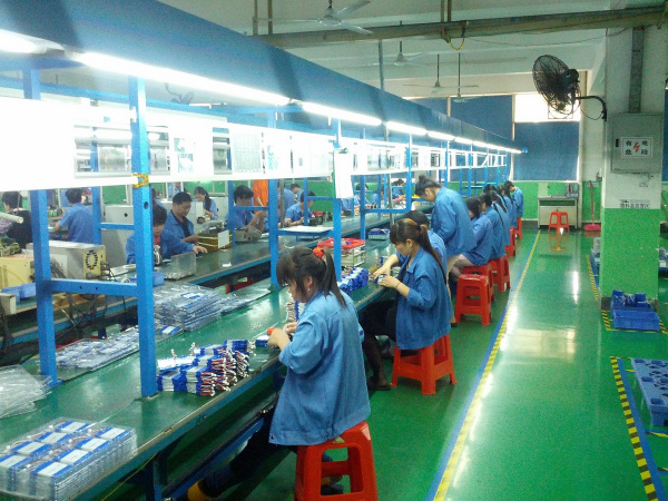 A line of battery workers