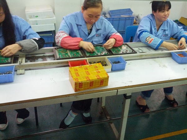 Workers putting together DMMs