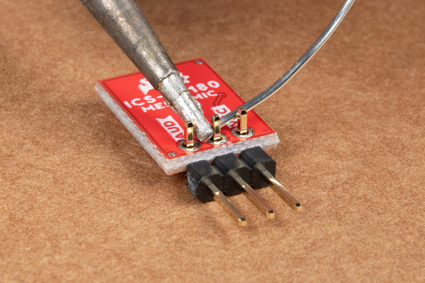 Right angle header pins being soldered to MEMS microphone.