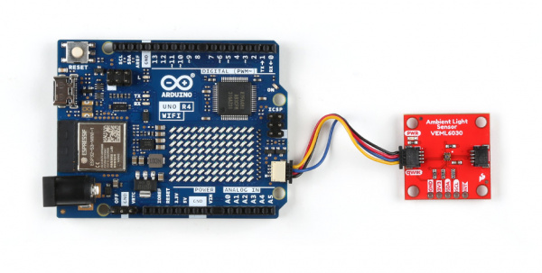 Plug one end of the qwiic connector into the qwiic port on the breakout board, and the other end into the qwiic connector on the Arduino Uno R4 WiFi board