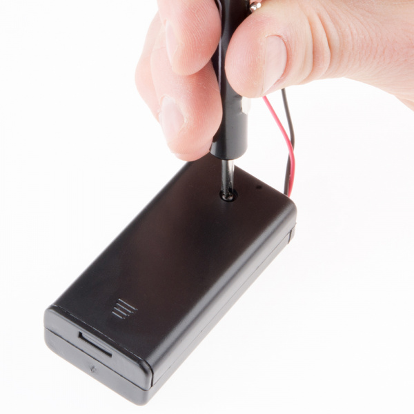 Use a screwdriver to open the battery pack