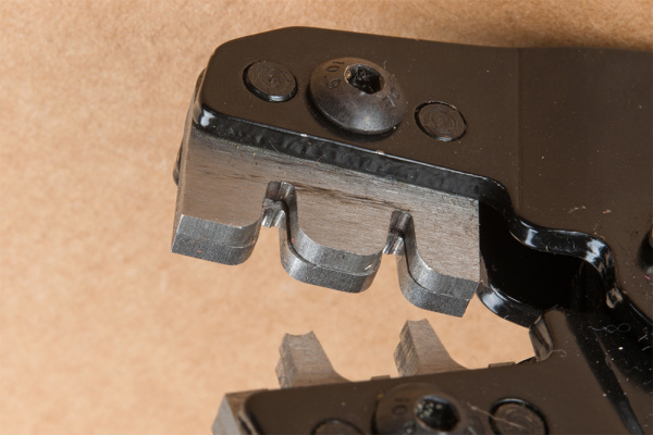 Close-Up of the Crimp Tool With Two Grooves and Die Recessed for Insulator Tab