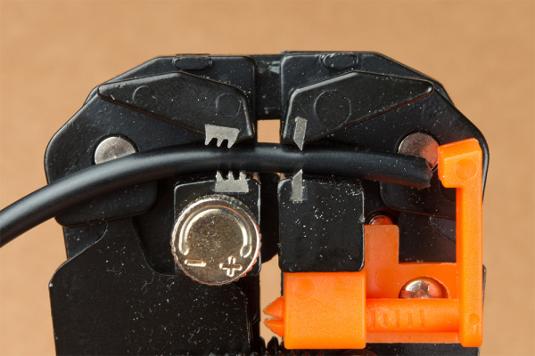 Insert Cable Between Self-Adjusting Wire Stripper's Jaws