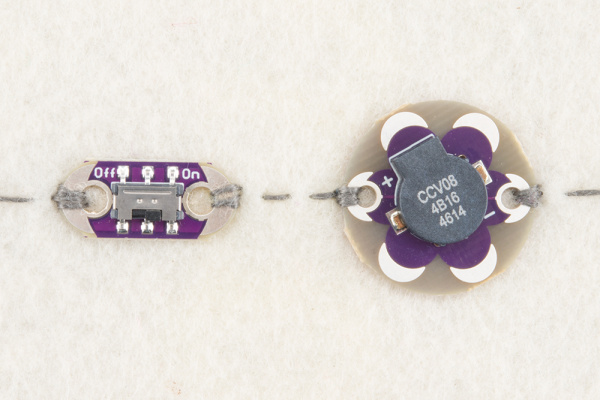 Piezo buzzer sewn into a circuit with a slide switch