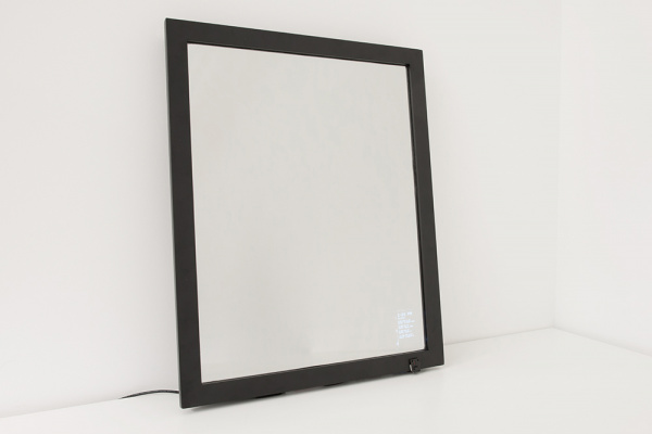 Smart mirror resting on a table