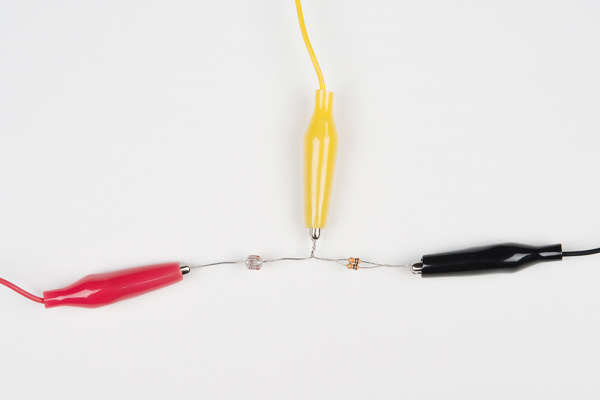 Alligator clips clamped onto photocell circuit