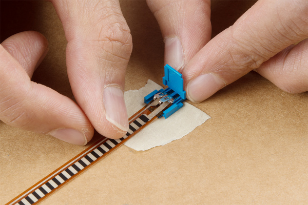 Flex Sensor Held Against Clincher Connector with Tape