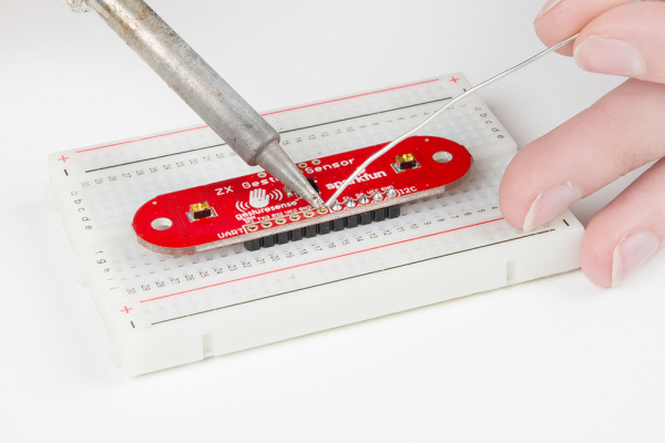 Soldering the header pins to the nine through holes