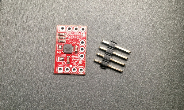 Snapped PCB next to 0.1" header