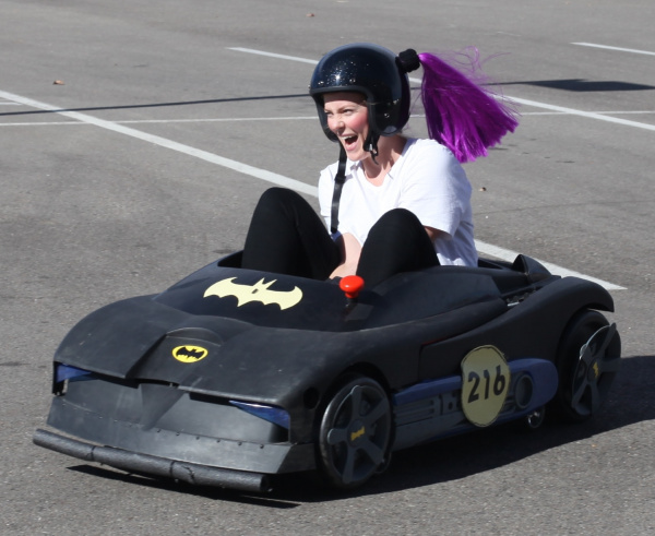 Smiling big in Batmobile