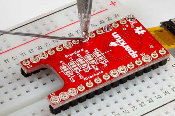 Installing male headers on TeensyView shield for the Teensy with a breadboard.