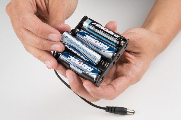 Insert AA Batteries into Pack