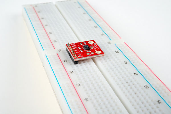 View of the board settled onto the pins  - one pin is soldered to check that the board is square