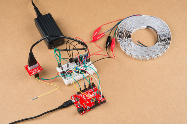 12V/5V power supply and a USB cable connected to an Arduino and the Non-Addressable RGB LED Strip 