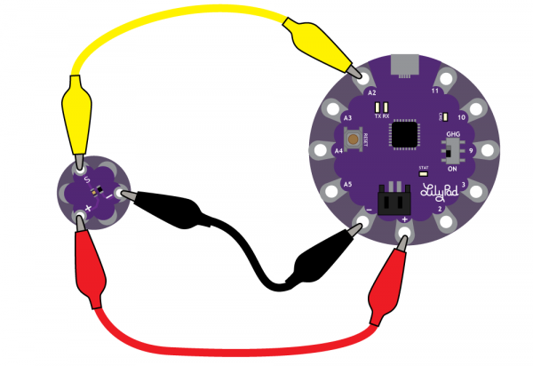 LilyPad Light Sensor clipped to a LilyPad USB with alligator clips