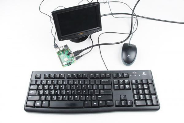 Raspberry Pi setup with a monitor, keyboard, and mouse