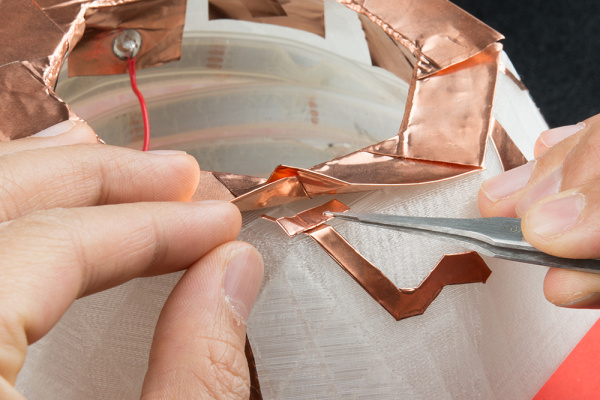 Add conductive adhesive copper tape between layers to conduct